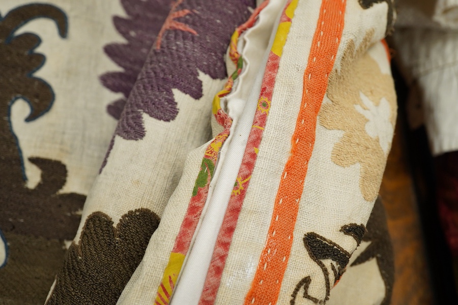 A late 19th early 20th century Uzbekistan (possibly Samarkand) embroidered Suzani. Made from hand loomed linen, pieced together then hand embroidered with large decorative sun or moon motifs as a large table cover or han